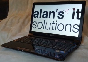 Alan's IT Solutions displayed on a laptop